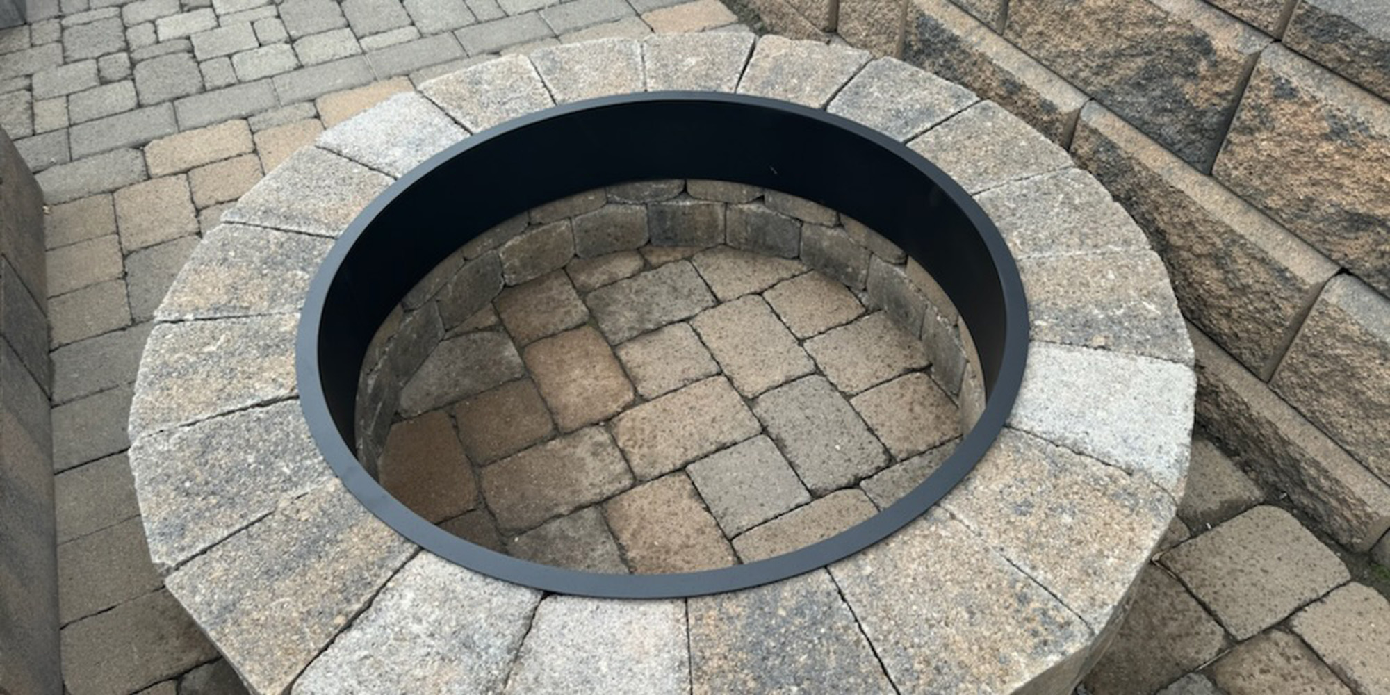 a fire pit made of Brooklynne Stone retaining wall brick from Oregon Block
