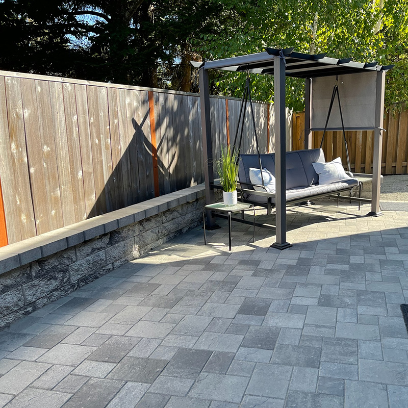 outdoor living area with patio swing built with AB Courtyard Collection blocks from Oregon Block